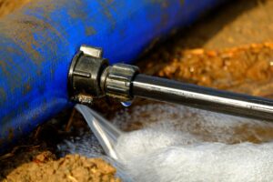 burst pipe spraying water